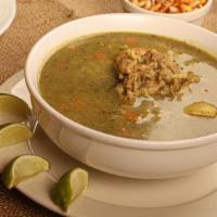 Aguadito De Mariscos · Cilantro soup with rice and seafood mix.