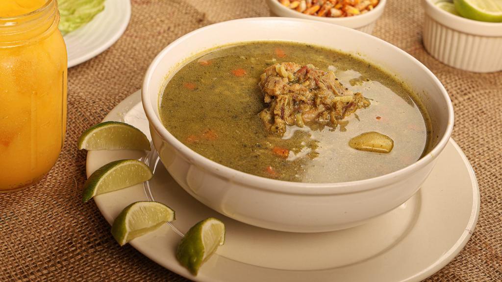 Aguadito De Mariscos · Cilantro soup with rice and seafood mix.