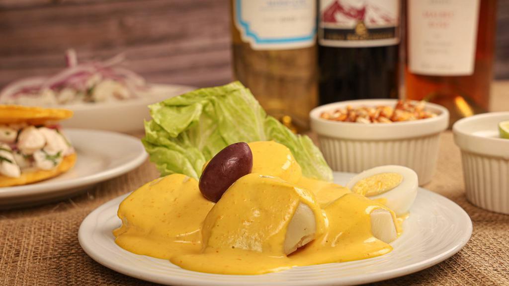 Papa A La Huancaina · boiled  potato with huancaina sauce.