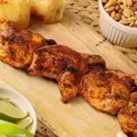 Anticucho De Pollo · Grilled chicken served with Peruvian corn, and potatoes.