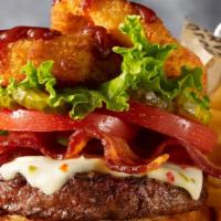 Wild West Burger (1720 Cals) · Topped with Pepper Jack cheese, Applewood smoked bacon, onion rings, Pit Boss BBQ sauce, pic...