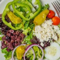 Greek Salad · Lettuce, tomatoes, onions, cucumbers, kalamata olives, green peppers, pepperoncini and feta ...