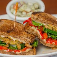 Garden Sandwich · Fried green tomatoes, Swiss cheese, lettuce, onion, cucumbers, roasted red peppers and tomat...