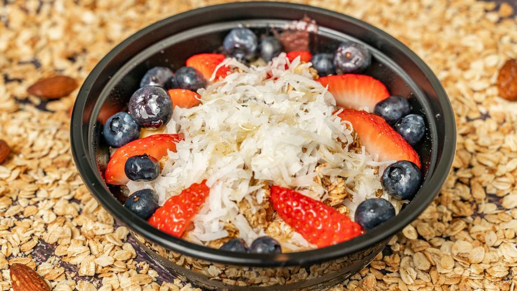 Brazilian Açai Bowl · Organic açai, banana, blueberry, strawberry, coconut flakes, organic granola, and organic agave. Additional fruits or toppings for additional charge.