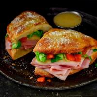 Ham & Cheese Deli Boat · Pizza dough baked into a crunchy, golden crust then topped with butter and romano. Layered w...