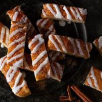 Cinnamon Stix · Freshly baked bread topped with cinnamon & vanilla icing.