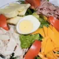 Chef Salad · Romaine lettuce, tomatoes, ham, turkey, cheddar, provolone, and a hard boiled egg.