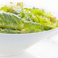 Caesar Salad · Heart of romaine, baby spinach, shaved Parmesan, signature Caesar dressing.