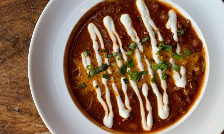 Tavern Chili · beef chili, red beans, sour cream, cheddar