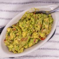Chunky Guacamole Dip · Homemade guacamole with chunks of fresh avocado, pico de gallo, fresh lime juice and a sprin...