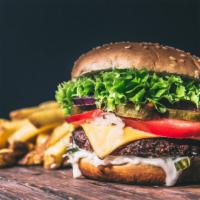 Millennium Burger · ½ pound burger, cheddar cheese, bacon, avocado spread, lettuce, tomato and sriracha ranch sa...