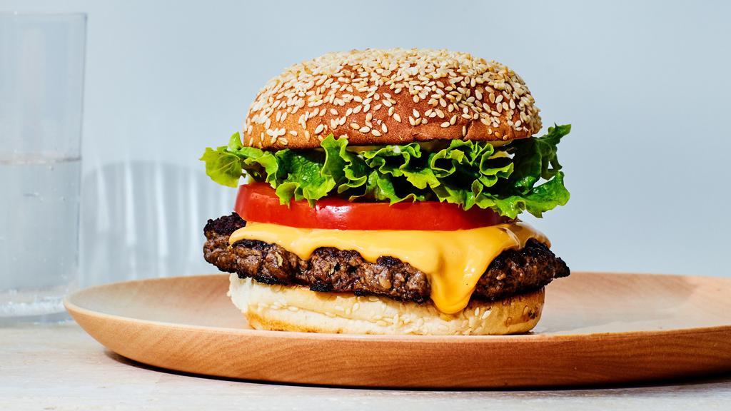 Uptown Burger · 1/2 pound burger, lettuce, tomato, uptown sauce on a brioche bun.
