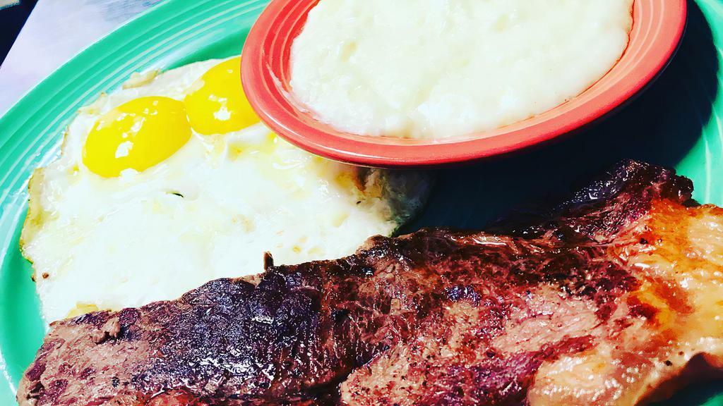 Steak And Eggs · 6oz NY Strip steak grilled to medium rare, served with two eggs, choice of side and a fluffy flying biscuit.