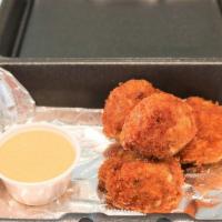 Pimento Cheese Fritters · Spicy pimento cheese hand-breaded and flash fried. Served with a spicy aioli for dipping.