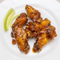 Baked Chicken Wings · Ten baked wings with choice of sauce.