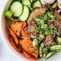 Bulgogi Bowl · Grilled Skirt Steak, Artisan Greens, Cucumber, Shaved Zucchini, carrot, radish, kalbi dressing