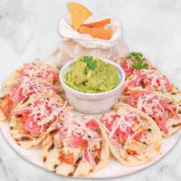 Taco Fiesta Kit · Enjoy a delicious selection of 10 tacos filled with a protein of your choice, queso fresco, ...