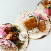 Three Tacos · Queso fresco, pickled red onions, cilantro, radish and option of lime-sliced popcorn or chips.
