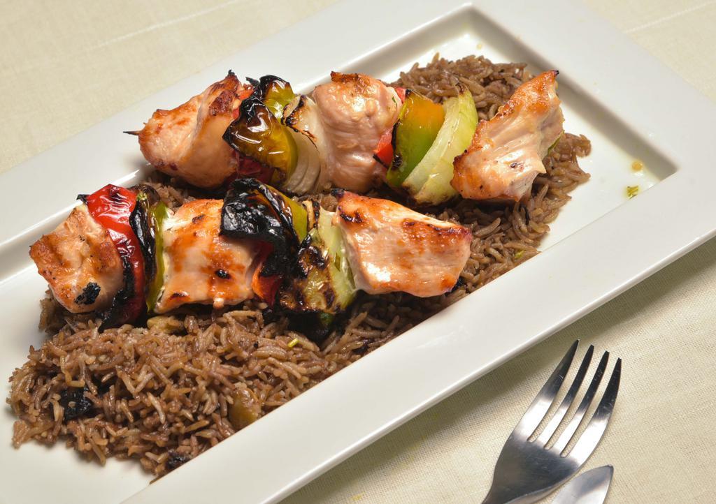 Chicken Kebab · Open flame grilled chicken with veggies served over black mushroom rice.