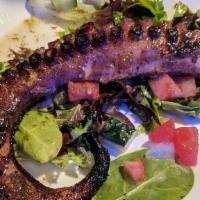 Grilled Octopus · Grilled tender served over grape tomatoes, red onions arugula.