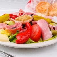Antipasto Salad · Lettuce, tomatoes, black olives, salami, provolone cheese, green peppers and pepperoncini.
