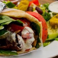 Gyro Sandwich · Seasoned blend of thinly sliced beef and lamb served in a heated pita with lettuce, tomato, ...