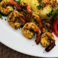 Grilled Jumbo Shrimp · Jumbo grilled shrimp marinated with garlic and herbs. Served with rice, salad, pita bread, a...