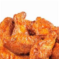 Chicken Wings · Four pieces. Grilled seasoned chicken wings tossed in our house pepper sauce.