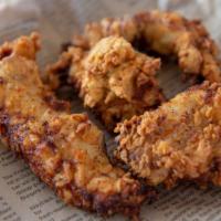 Chicken Tenders · Hand-breaded tenders accompanied by your choice of dipping sauce. They may sound traditional...