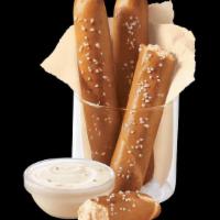 Dq® Bakes!® Pretzel Sticks With Zesty Queso · Soft pretzel sticks, served hot from the oven, topped with salt and served with warm zesty q...