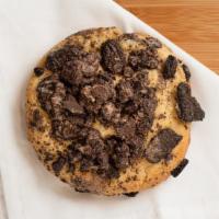 Cookies & Cream Cookie · Cookie dough mixed with white, and chocolate chips, stuffed oreo, and topped with cookie cru...