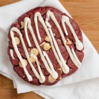 Red Velvet Cookie · Red velvet cookie dough mixed with white, and chocolate pieces topped with cream cheese icing