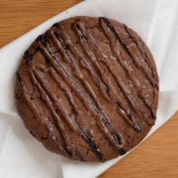 Nutella Stuffed Cookie · Nutella infused cookie dough stuffed to perfection with nutella and topped with nutella driz...