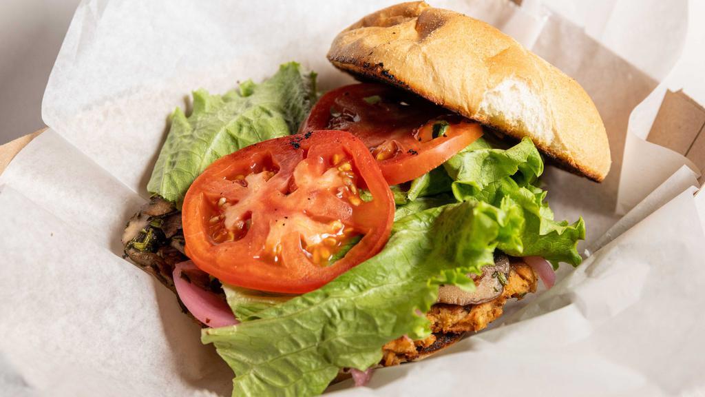 7 Mile Burger · Salmon patty, seasoned mushrooms, pickled onions, lettuce and tomato.