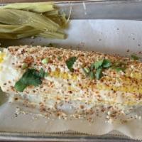 Mexican Street Corn · Topped off with mayonnaise, cotija cheese, chili powder, & cilantro.