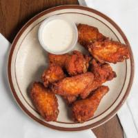 Order Of Hot Wings · Crispy fried to order and served with a side of buffalo sauce and ranch or bleu cheese. Eigh...