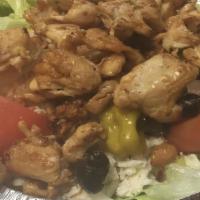 Grilled Chicken Salad · Marinated chopped and grilled Chicken breast on a Medium Greek Salad.