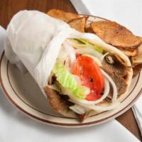 Beef & Lamb Gyro Wrap Sandwich · Spiced beef and lamb slices wrapped in a toasted flatbread pita with lettuce, tomatoes, onio...