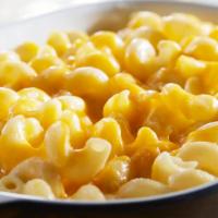 Macaroni And Cheese · Tender corkscrew pasta tossed in creamy white cheddar cheese sauce, topped with cheddar chee...