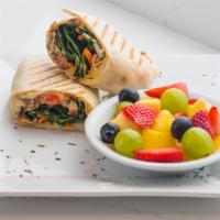 Hummus & Veggie Wrap · Traditional hummus spread with cucumbers, carrots, caramelized onions, spinach, tomato and r...