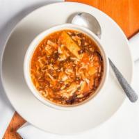 Hot And Sour Soup · Rich and tangy broth with chicken, silken tofu, bamboo shoot, mushroom and egg.