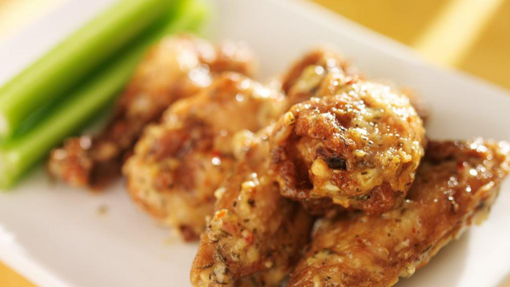 Garlic Parmesan Bone-In Wings · Delicious traditional wings tossed in garlic parm sauce made to perfection and crisp.