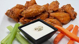 Gametime Wings · Fresh bone-in wings that are deep fried to sear in the flavors. Served with carrots, celery,...
