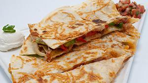 Quesadilla · Parmesan crusted flour tortilla stuffed with cheddar and jack cheeses bacon, grilled onions,...