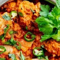 Karahi Chicken · Chicken cooked with garlic, ginger, garden fresh tomatoes, and chili powder.