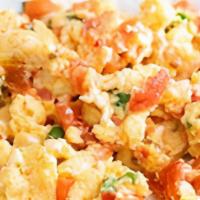Perico Rebuelto · Scrambled eggs with ham, onion, pepper and tomatoes.