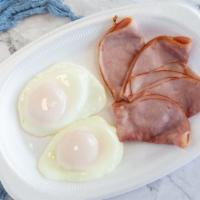 2 Fried Eggs With Side Of Ham · With cafe con leche.
