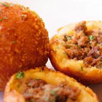 Meat Balls · (Papa Rellena). Fried potato stuffed with meat.