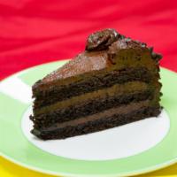 Chocolate Beast · Rich chocolate cake with fudge icing and chocolate chips.