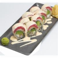 Suviche Roll · Crispy shrimp, cream cheese and avocado, topped with ruby red tuna covered in our signature ...